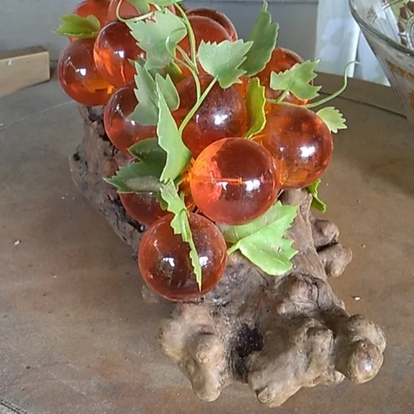 Vintage 1970s large orange lucien grapes on driftwood